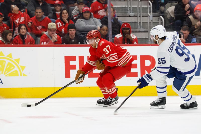 Dec 28, 2025; Detroit, Michigan, USA;  Detroit Red Wings left wing J.T. Compher (37) skates with the puck in the second period against the Toronto Maple Leafs at Little Caesars Arena. Mandatory Credit: Rick Osentoski-Imagn Images