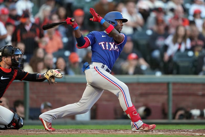 Aug 12, 2023; San Francisco, California, USA; Texas Rangers left fielder J.P. Martinez (50) hits a single for his first MLB hit during the fourth inning against the San Francisco Giants at Oracle Park. Mandatory Credit: Darren Yamashita-USA TODAY Sports