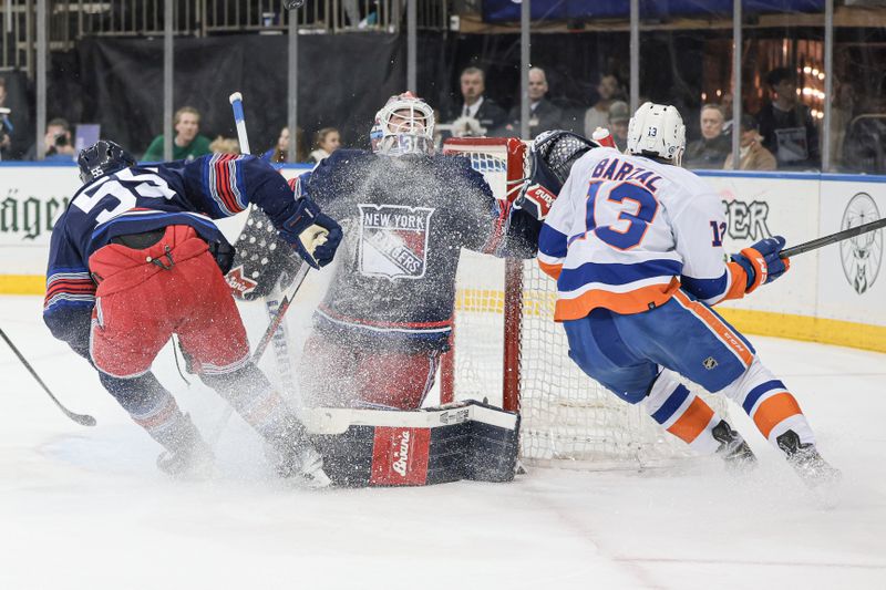 Mar 17, 2024; New York, New York, USA; New York Rangers goaltender Igor Shesterkin (31) makes a save against New York Islanders center Mathew Barzal (13) in front of defenseman Ryan Lindgren (55) during the first period at Madison Square Garden. Mandatory Credit: Vincent Carchietta-USA TODAY Sports