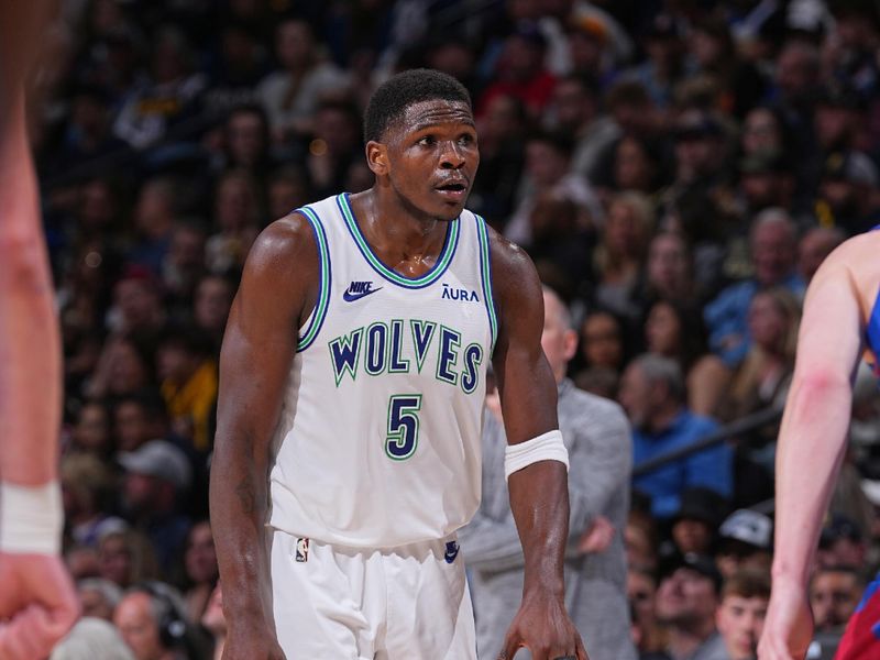 DENVER, CO - MARCH 29: Anthony Edwards #5 of the Minnesota Timberwolves dribbles the ball during the game against the Denver Nuggets on March 29, 2024 at the Ball Arena in Denver, Colorado. NOTE TO USER: User expressly acknowledges and agrees that, by downloading and/or using this Photograph, user is consenting to the terms and conditions of the Getty Images License Agreement. Mandatory Copyright Notice: Copyright 2024 NBAE (Photo by Bart Young/NBAE via Getty Images)