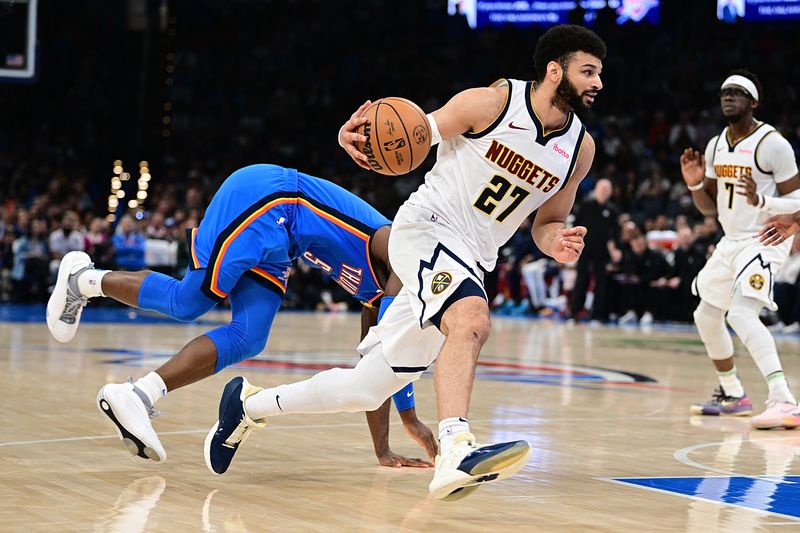 OKLAHOMA CITY, OKLAHOMA - JANUARY 31: Jamal Murray #27 of the Denver Nuggets handles the ball during the second half against the Oklahoma City Thunder at Paycom Center on January 31, 2024 in Oklahoma City, Oklahoma. NOTE TO USER: User expressly acknowledges and agrees that, by downloading and or using this Photograph, user is consenting to the terms and conditions of the Getty Images License Agreement. (Photo by Joshua Gateley/Getty Images)