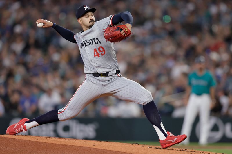 Jun 29, 2024; Seattle, Washington, USA; Minnesota Twins starting pitcher Pablo López (49) throws against the Seattle Mariners during the first inning at T-Mobile Park. Mandatory Credit: John Froschauer-USA TODAY Sports