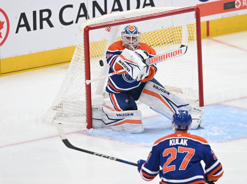 Apr 9, 2025; Edmonton, Alberta, CAN;  Edmonton Oilers goalie Calvin Pickard (30) makes a save during the first period against the St. Louis Blues at Rogers Place. Mandatory Credit: Walter Tychnowicz-Imagn Images