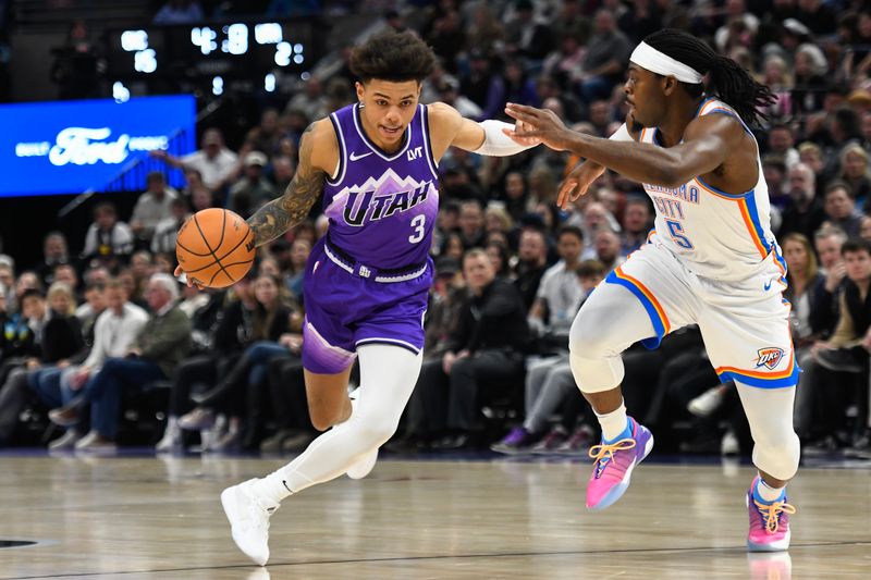 SALT LAKE CITY, UTAH - FEBRUARY 06: Keyonte George #3 of the Utah Jazz drives past Luguentz Dort #5 of the Oklahoma City Thunder during the first half of a game at Delta Center on February 06, 2024 in Salt Lake City, Utah. NOTE TO USER: User expressly acknowledges and agrees that, by downloading and or using this photograph, User is consenting to the terms and conditions of the Getty Images License Agreement. (Photo by Alex Goodlett/Getty Images)