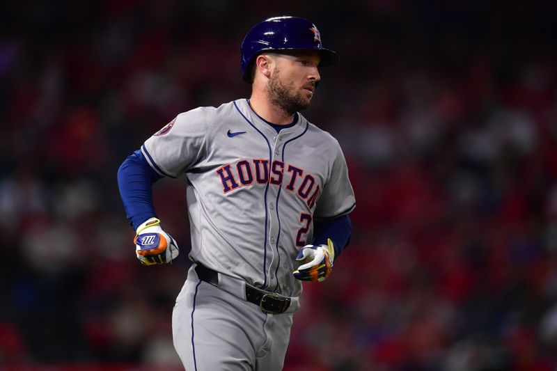 Sep 13, 2024; Anaheim, California, USA; Houston Astros third baseman Alex Bregman (2) hits a single against the Los Angeles Angels during the seventh inning at Angel Stadium. Mandatory Credit: Gary A. Vasquez-Imagn Images