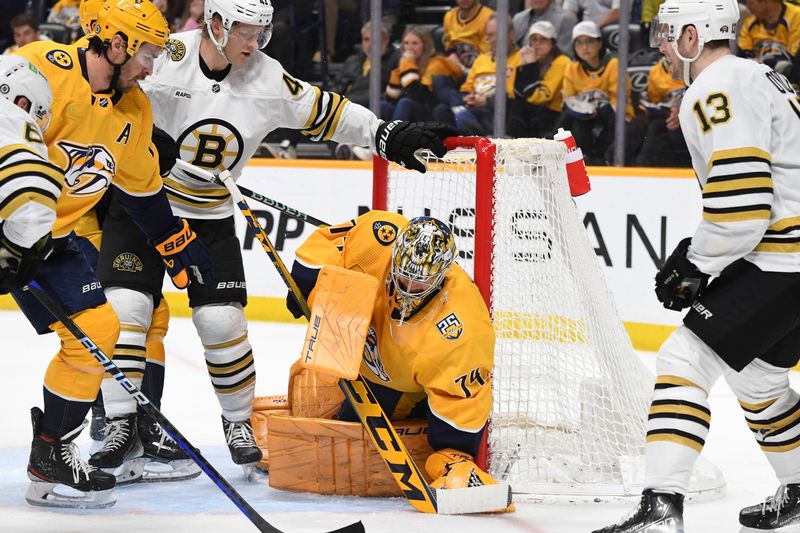 Apr 2, 2024; Nashville, Tennessee, USA; Nashville Predators goaltender Juuse Saros (74) holds onto the puck after a save during the second period against the Boston Bruins at Bridgestone Arena. Mandatory Credit: Christopher Hanewinckel-USA TODAY Sports