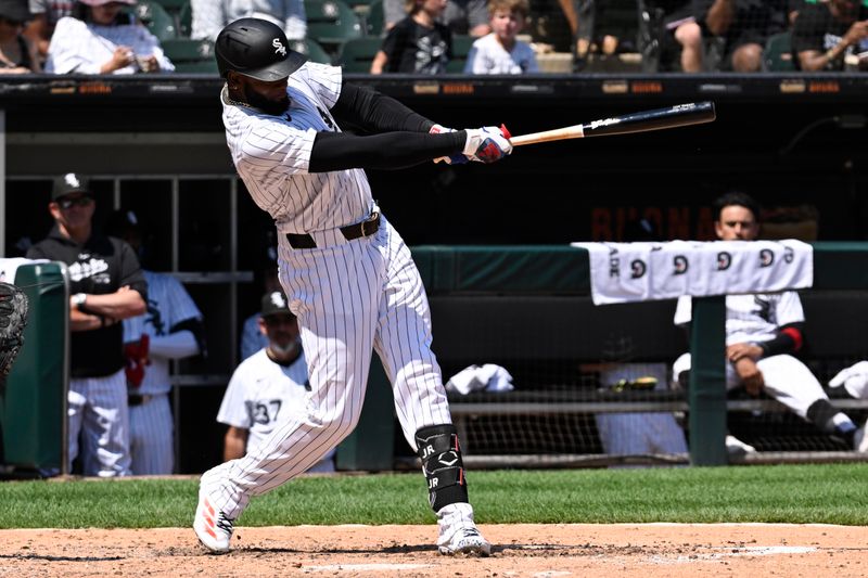 Jul 10, 2024; Chicago, Illinois, USA;  Chicago White Sox outfielder Luis Robert Jr. (88) hits a two-run home run against the Minnesota Twins during the sixth inning at Guaranteed Rate Field. Mandatory Credit: Matt Marton-USA TODAY Sports