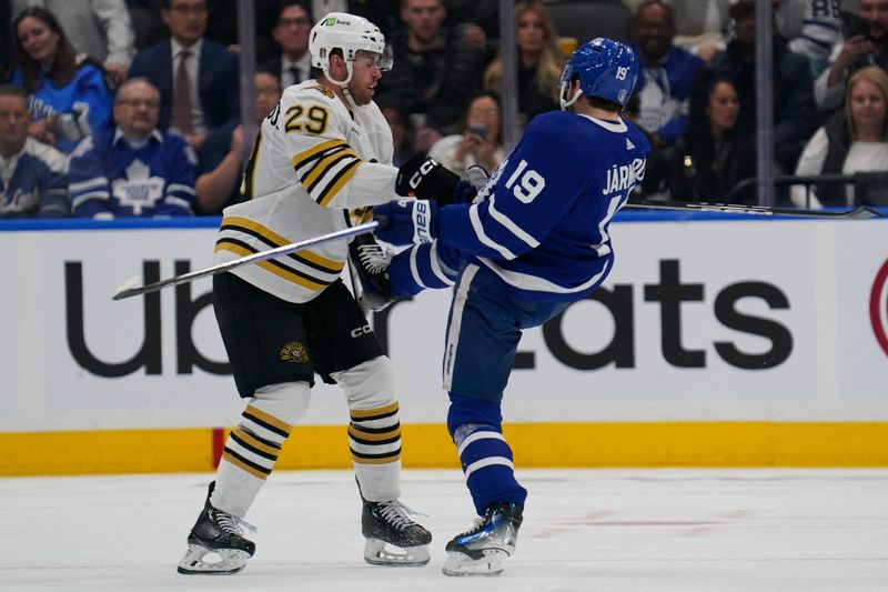 Apr 24, 2024; Toronto, Ontario, CAN; Toronto Maple Leafs forward Calle Jarnkrok (19) skate comes up as he gets hit by Boston Bruins defenseman Parker Wotherspoon (29) during the second period of game three of the first round of the 2024 Stanley Cup Playoffs at Scotiabank Arena. Mandatory Credit: John E. Sokolowski-USA TODAY Sports