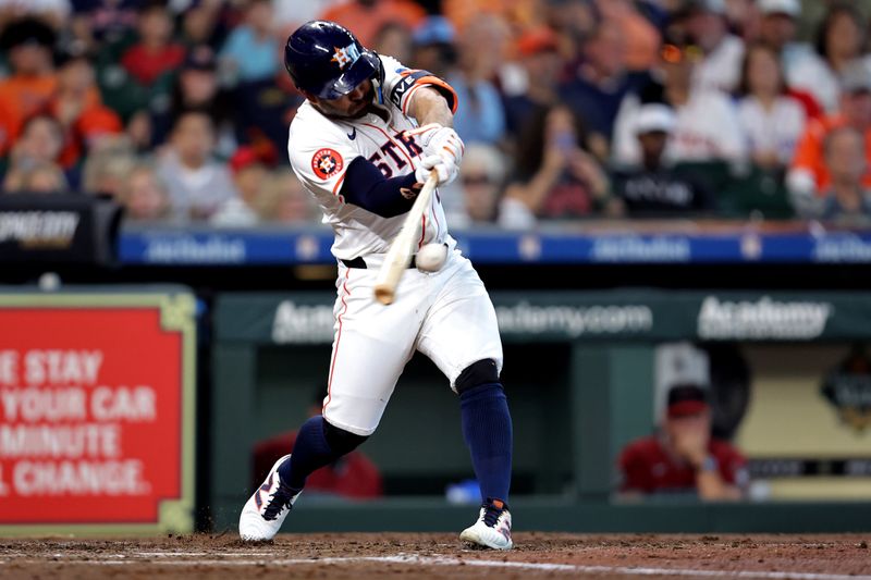 Sep 7, 2024; Houston, Texas, USA; Houston Astros second baseman Jose Altuve (27) hits a double against the Arizona Diamondbacks during the third inning at Minute Maid Park. Mandatory Credit: Erik Williams-Imagn Images