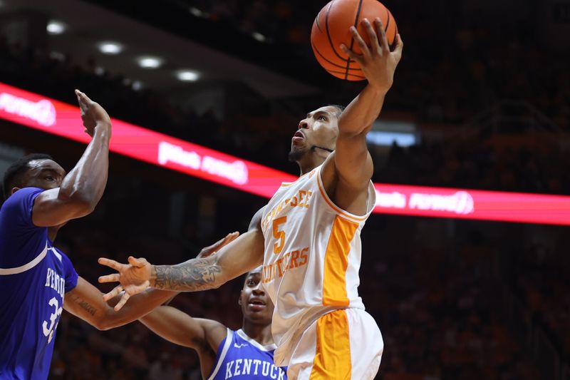 Mar 9, 2024; Knoxville, Tennessee, USA; Tennessee Volunteers guard Zakai Zeigler (5) goes to the basket against the Kentucky Wildcats during the second half at Thompson-Boling Arena at Food City Center. Mandatory Credit: Randy Sartin-USA TODAY Sports