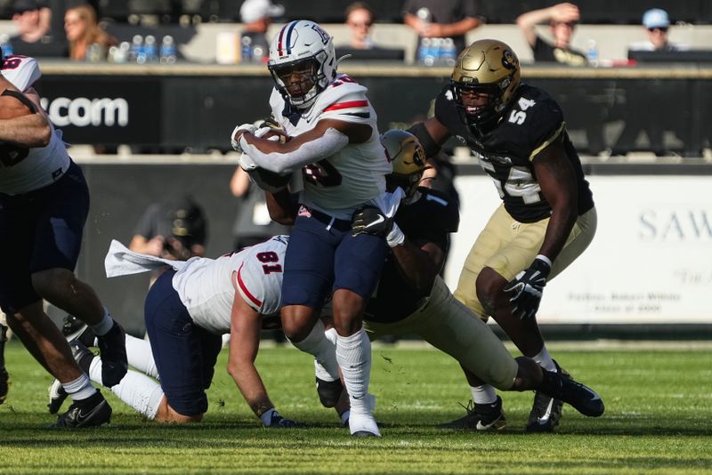 Oct 16, 2021; Boulder, Colorado, USA; Arizona Wildcats wide receiver Jamarye Joiner (10) carries the ball against the Colorado Buffaloes in the third quarter at Folsom Field. Mandatory Credit: Ron Chenoy-USA TODAY Sports