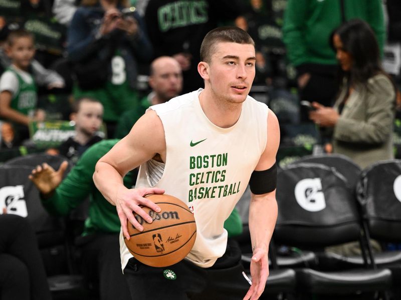 BOSTON, MASSACHUSETTS - APRIL 14: Payton Pritchard #11 of the Boston Celtics dribbles the ball during warmups before a game against the Washington Wizards at the TD Garden on April 14, 2024 in Boston, Massachusetts. NOTE TO USER: User expressly acknowledges and agrees that, by downloading and or using this photograph, User is consenting to the terms and conditions of the Getty Images License Agreement. (Photo by Brian Fluharty/Getty Images)