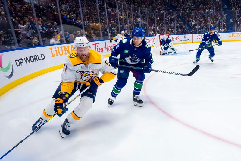 Jan 3, 2025; Vancouver, British Columbia, CAN; Vancouver Canucks forward Teddy Blueger (53) defends against Nashville Predators forward Steven Stamkos (91) in the first period at Rogers Arena. Mandatory Credit: Bob Frid-Imagn Images