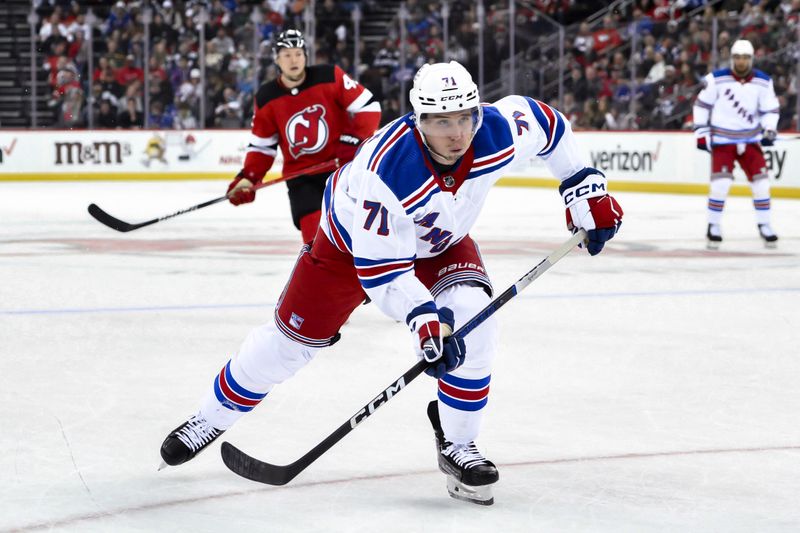 Nov 18, 2023; Newark, New Jersey, USA; New York Rangers center Tyler Pitlick (71) skates against the New Jersey Devils during the third period at Prudential Center. Mandatory Credit: John Jones-USA TODAY Sports