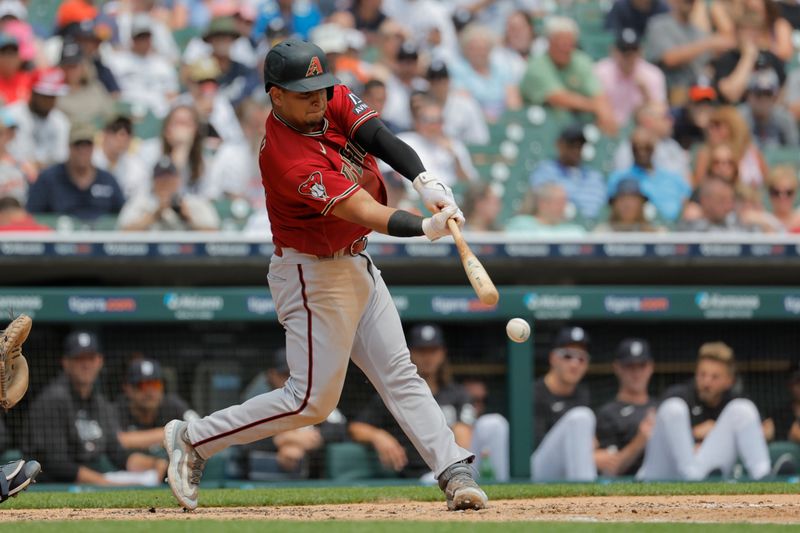 Jun 10, 2023; Detroit, Michigan, USA;  Arizona Diamondbacks catcher Gabriel Moreno (14) hits a double in the fifth inning against the Detroit Tigers at Comerica Park. Mandatory Credit: Rick Osentoski-USA TODAY Sports