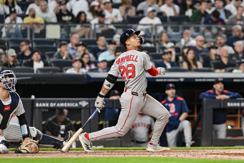 Jun 8, 2025; Bronx, New York, USA; Boston Red Sox second baseman Kristian Campbell (28) hits a two-run home run against the New York Yankees during the fifth inning at Yankee Stadium. Mandatory Credit: John Jones-Imagn Images
