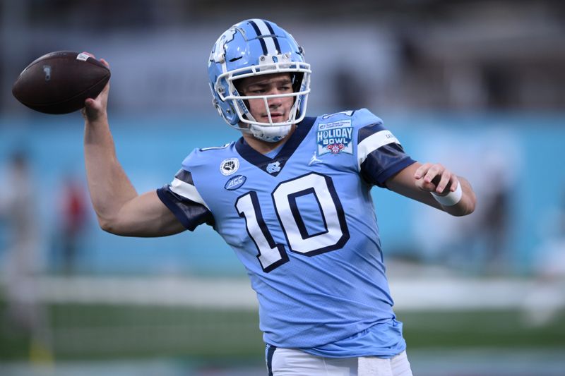 Dec 28, 2022; San Diego, CA, USA; North Carolina Tar Heels quarterback Drake Maye (10) warms up before the 2022 Holiday Bowl against the Oregon Ducks at Petco Park. Mandatory Credit: Orlando Ramirez-USA TODAY Sports