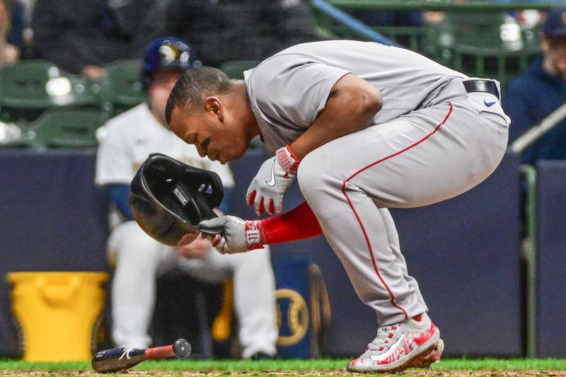 Apr 22, 2023; Milwaukee, Wisconsin, USA; Boston Red Sox third baseman Rafael Devers (11) reacts after striking out in the eighth inning during game against the Milwaukee Brewers at American Family Field. Mandatory Credit: Benny Sieu-USA TODAY Sports