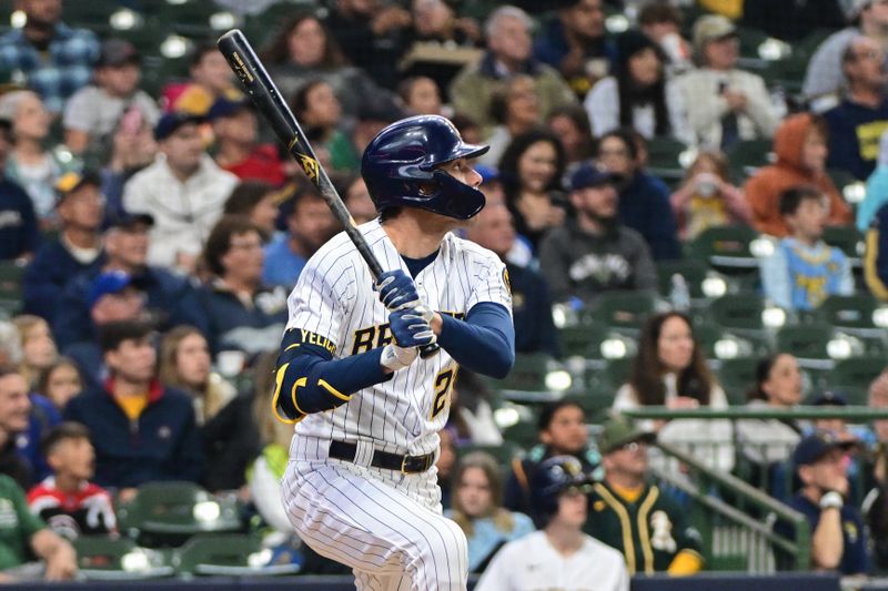 Jun 11, 2023; Milwaukee, Wisconsin, USA; Milwaukee Brewers designated hitter Christian Yelich (22) watches after hitting a solo home run against the Oakland Athletes in the second inning at American Family Field. Mandatory Credit: Benny Sieu-USA TODAY Sports