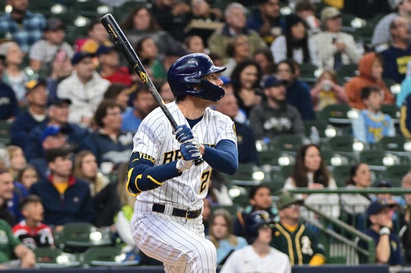 Jun 11, 2023; Milwaukee, Wisconsin, USA; Milwaukee Brewers designated hitter Christian Yelich (22) watches after hitting a solo home run against the Oakland Athletes in the second inning at American Family Field. Mandatory Credit: Benny Sieu-USA TODAY Sports