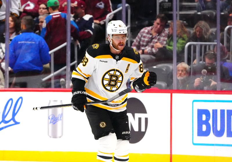 Oct 16, 2024; Denver, Colorado, USA; Boston Bruins right wing David Pastrnak (88) celebrates his goal in the second period against the Colorado Avalanche at Ball Arena. Mandatory Credit: Ron Chenoy-Imagn Images