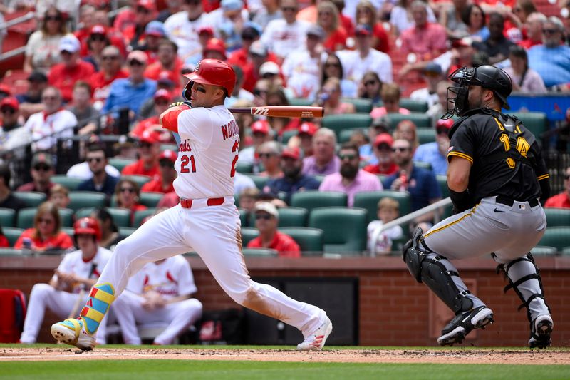 May 7, 2025; St. Louis, Missouri, USA;  St. Louis Cardinals left fielder Lars Nootbaar (21) hits a one run single against the Pittsburgh Pirates during the third inning at Busch Stadium. Mandatory Credit: Jeff Curry-Imagn Images