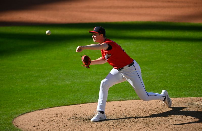 Oct 5, 2024; Cleveland, Ohio, USA; Cleveland Guardians pitcher Tim Herrin (29) throws a pitch against the Detroit Tigers in the seventh inning in game one of the ALDS for the 2024 MLB Playoffs at Progressive Field. Mandatory Credit: David Richard-Imagn Images