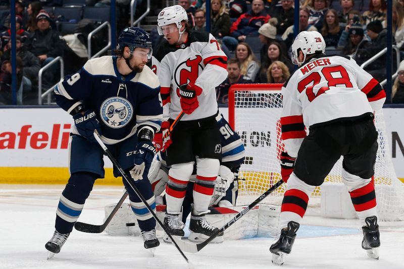 Jan 19, 2024; Columbus, Ohio, USA; Columbus Blue Jackets goalie Elvis Merzlikins (90) makes a pad save through the screen of New Jersey Devils right wing Tyler Toffoli (73) during the second period at Nationwide Arena. Mandatory Credit: Russell LaBounty-USA TODAY Sports