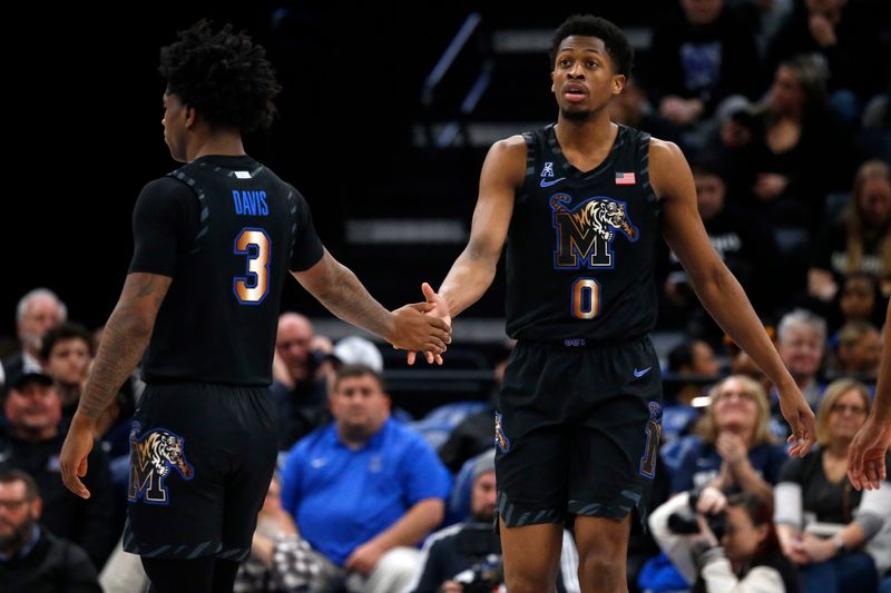 Jan 26, 2023; Memphis, Tennessee, USA; Memphis Tigers guard Kendric Davis (3) reacts with guard Elijah McCadden (0) after a basket during the second half against the Southern Methodist Mustangs at FedExForum. Mandatory Credit: Petre Thomas-USA TODAY Sports