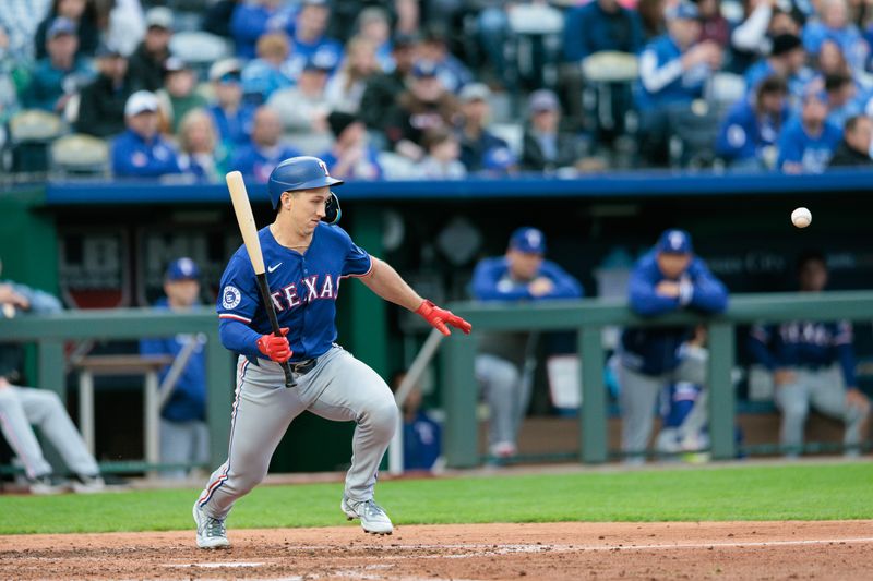 May 4, 2024; Kansas City, Missouri, USA; Texas Rangers outfielder Wyatt Langford (36) reacts after an awkward hit during the fifth inning against the Kansas City Royals at Kauffman Stadium. Mandatory Credit: William Purnell-USA TODAY Sports