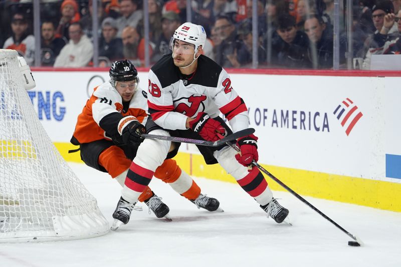 Nov 22, 2025; Philadelphia, Pennsylvania, USA; New Jersey Devils right wing Timo Meier (28) controls the puck against Philadelphia Flyers right wing Bobby Brink (10) in the second period at Xfinity Mobile Arena. Mandatory Credit: Kyle Ross-Imagn Images