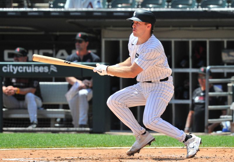 Jun 25, 2025; Chicago, Illinois, USA; Chicago White Sox catcher Kyle Teel (8) hits an RBI single during the first inning against the Arizona Diamondbacks at Rate Field. Mandatory Credit: Patrick Gorski-Imagn Images