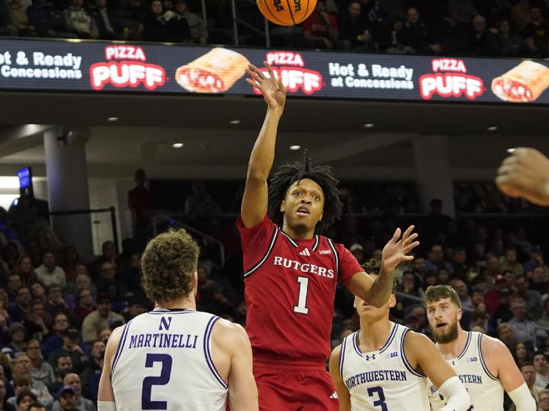 Jan 29, 2025; Evanston, Illinois, USA;Northwestern Wildcats forward Nick Martinelli (2) defends Rutgers Scarlet Knights guard Jamichael Davis (1) during the first half at Welsh-Ryan Arena. Mandatory Credit: David Banks-Imagn Images