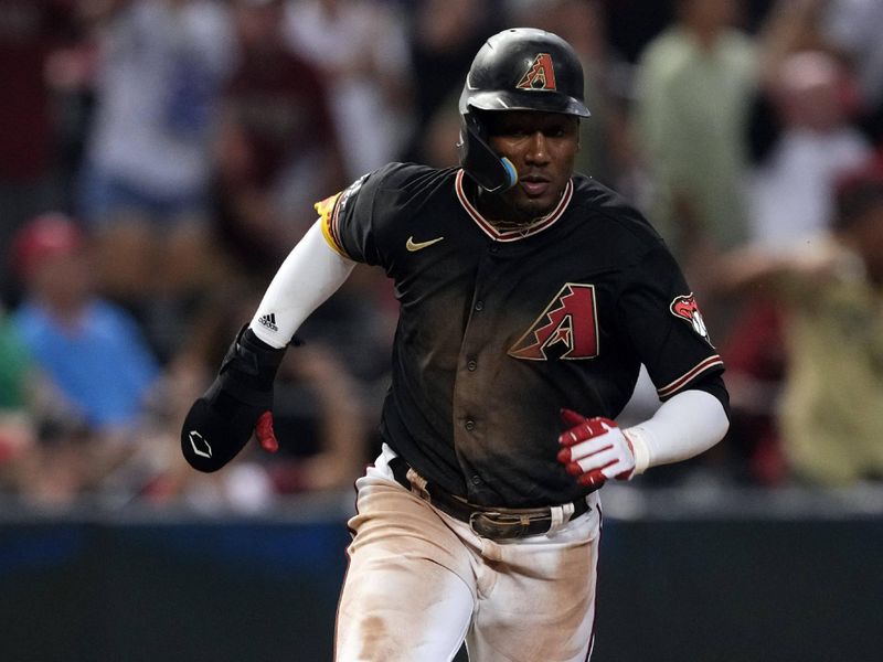 Aug 26, 2023; Phoenix, Arizona, USA; Arizona Diamondbacks shortstop Geraldo Perdomo (2) scores a run against the Cincinnati Reds during the tenth inning at Chase Field. Mandatory Credit: Joe Camporeale-USA TODAY Sports