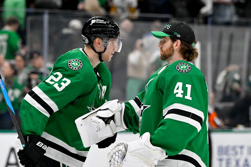 Mar 22, 2024; Dallas, Texas, USA; Dallas Stars defenseman Esa Lindell (23) and goaltender Scott Wedgewood (41) celebrate on the ice after defeating the Pittsburgh Penguins at the American Airlines Center. Mandatory Credit: Jerome Miron-USA TODAY Sports