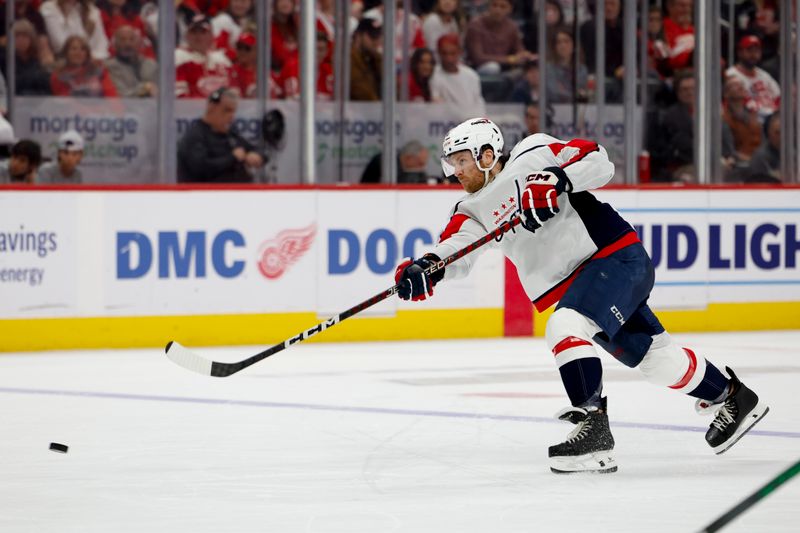 Apr 9, 2024; Detroit, Michigan, USA; Washington Capitals defenseman Nick Jensen (3) takes a shot in the third period against the Detroit Red Wings at Little Caesars Arena. Mandatory Credit: Rick Osentoski-USA TODAY Sports