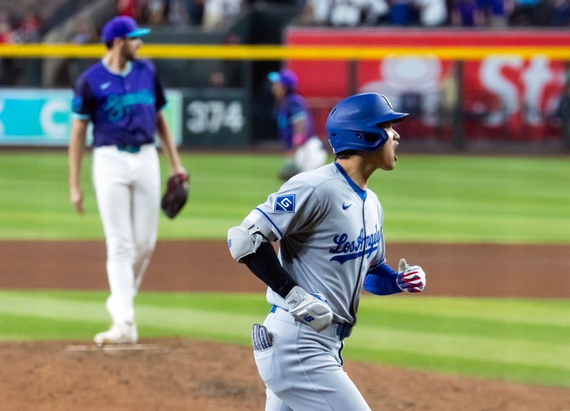 May 9, 2025; Phoenix, Arizona, USA; Los Angeles Dodgers designated hitter Shohei Ohtani celebrates after hitting a three run home run in the ninth inning against the Arizona Diamondbacks at Chase Field. Mandatory Credit: Mark J. Rebilas-Imagn Images