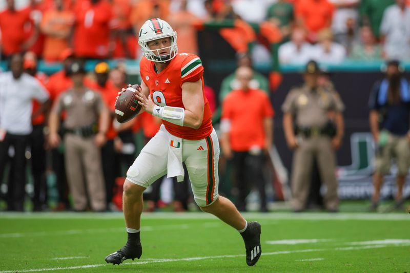 Sep 9, 2023; Miami Gardens, Florida, USA; Miami Hurricanes quarterback Tyler Van Dyke (9) looks for a passing option against the Texas A&M Aggies during the first quarter at Hard Rock Stadium. Mandatory Credit: Sam Navarro-USA TODAY Sports