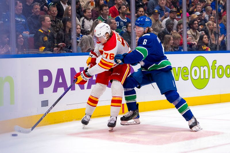 Apr 16, 2024; Vancouver, British Columbia, CAN; Vancouver Canucks forward Brock Boeser (6) checks Calgary Flames forward Martin Pospisil (76) in the second period at Rogers Arena. Mandatory Credit: Bob Frid-USA TODAY Sports