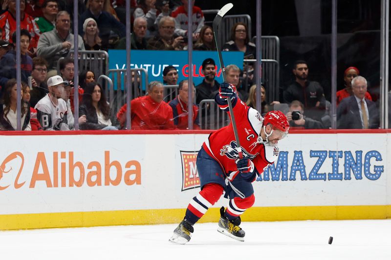 Jan 13, 2026; Washington, District of Columbia, USA; Washington Capitals left wing Alex Ovechkin (8) shoots the puck in overtime against the Montréal Canadiens at Capital One Arena. Mandatory Credit: Geoff Burke-Imagn Images