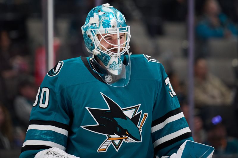 Oct 1, 2025; San Jose, California, USA; San Jose Sharks goaltender Yaroslav Askarov (30) looks on during a timeout against the Anaheim Ducks during the first period at SAP Center at San Jose. Mandatory Credit: Robert Edwards-Imagn Images