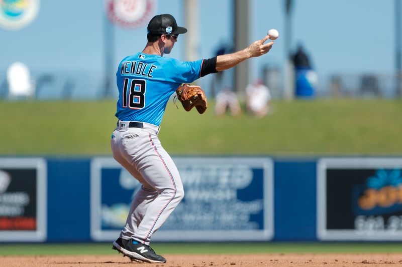 Mar 2, 2023; West Palm Beach, Florida, USA; Miami Marlins shortstop Joey Wendle (18) throws to second base for an out against the Washington Nationals during the fourth inning at The Ballpark of the Palm Beaches. Mandatory Credit: Sam Navarro-USA TODAY Sports