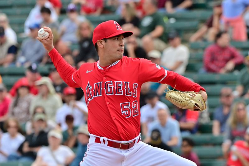 Mar 6, 2024; Tempe, Arizona, USA;  Los Angeles Angels pitcher Erik Martinez (52) throws in the first inning against the Oakland Athletics during a spring training game at Tempe Diablo Stadium. Mandatory Credit: Matt Kartozian-USA TODAY Sports