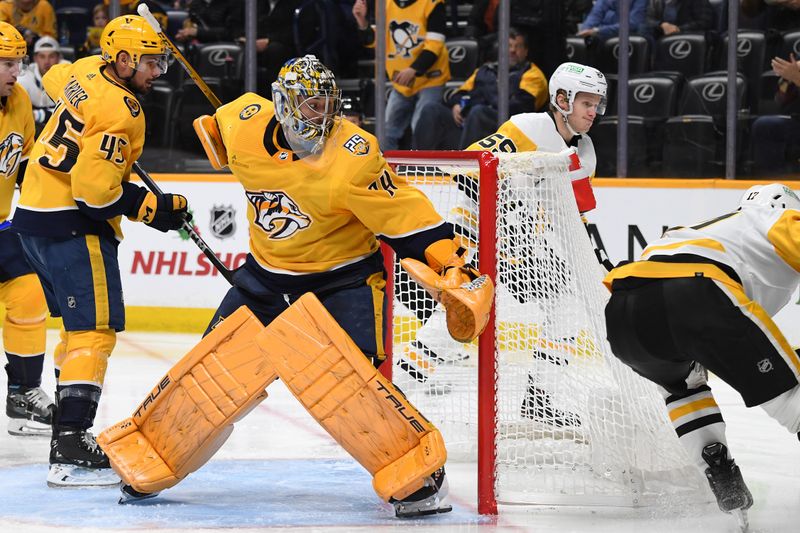 Nov 28, 2023; Nashville, Tennessee, USA; Nashville Predators goaltender Juuse Saros (74) follows the puck as his stick is stuck in the net during the second period against the Pittsburgh Penguins at Bridgestone Arena. Mandatory Credit: Christopher Hanewinckel-USA TODAY Sports