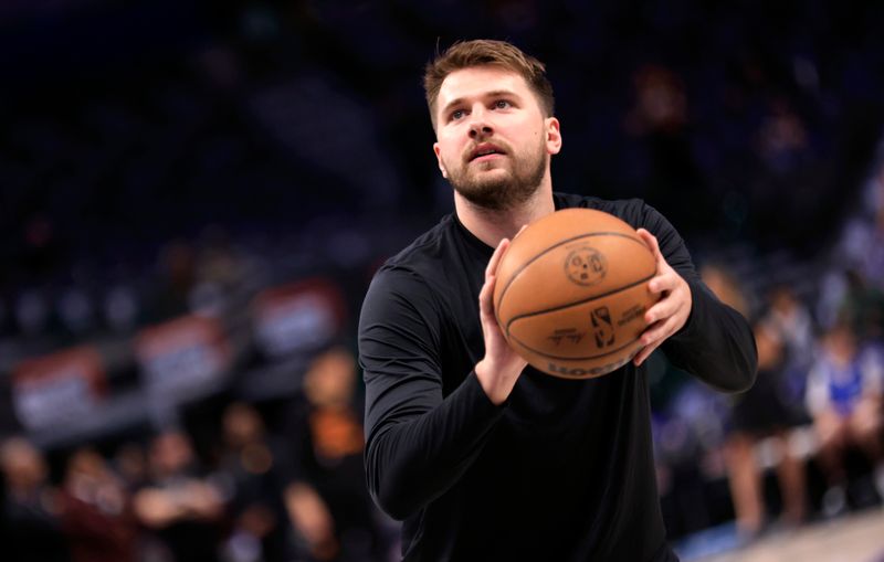 DALLAS, TX - FEBRUARY 22:  Luka Doncic #77 of the Dallas Mavericks  warms up before the game against the Phoenix Suns at American Airlines Center on February 22, 2024 in Dallas, Texas. NOTE TO USER: User expressly acknowledges and agrees that, by downloading and or using this photograph, User is consenting to the terms and conditions of the Getty Images License Agreement. (Photo by Ron Jenkins/Getty Images)