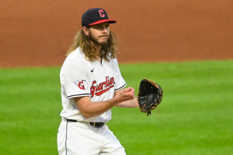 Apr 20, 2024; Cleveland, Ohio, USA; Cleveland Guardians relief pitcher Scott Barlow (58) celebrates a strikeout in the seventh inning against the Oakland Athletics at Progressive Field. Mandatory Credit: David Richard-USA TODAY Sports