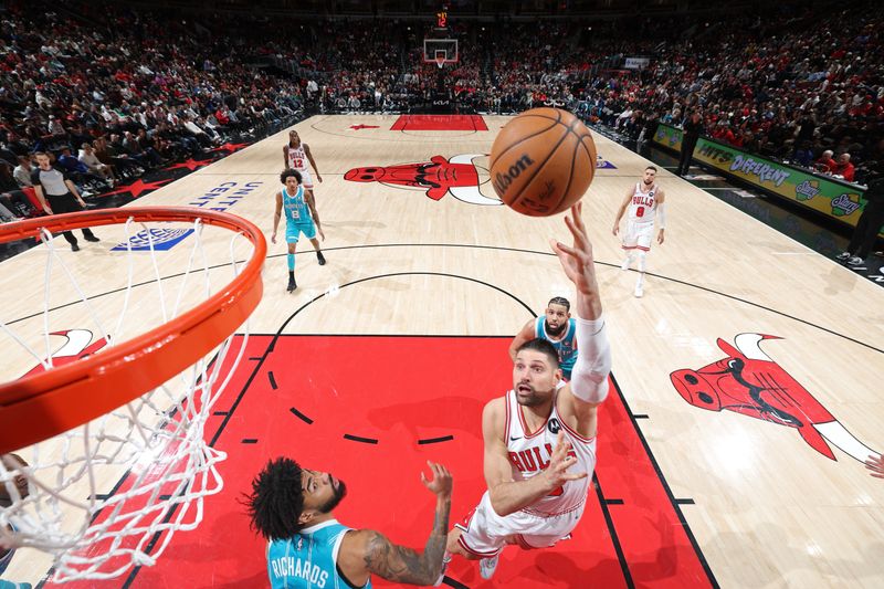 CHICAGO, IL - JANUARY 5: Nikola Vucevic #9 of the Chicago Bulls shoots the ball during the game against the Charlotte Hornets on January 5, 2024 at United Center in Chicago, Illinois. NOTE TO USER: User expressly acknowledges and agrees that, by downloading and or using this photograph, User is consenting to the terms and conditions of the Getty Images License Agreement. Mandatory Copyright Notice: Copyright 2024 NBAE (Photo by Jeff Haynes/NBAE via Getty Images)