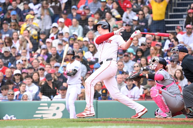 May 12, 2024; Boston, Massachusetts, USA;  Boston Red Sox first baseman Garrett Cooper (28) hits a double against the Washington Nationals during the third inning at Fenway Park. Mandatory Credit: Eric Canha-USA TODAY Sports