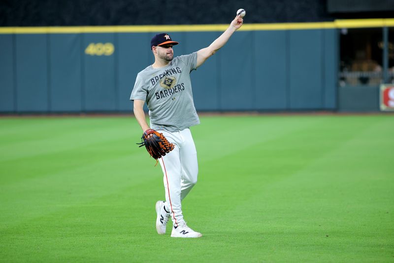 May 28, 2025; Houston, Texas, USA; Houston Astros center fielder Chas McCormick (20) warms up prior to the game against the Athletics at Daikin Park. Mandatory Credit: Erik Williams-Imagn Images