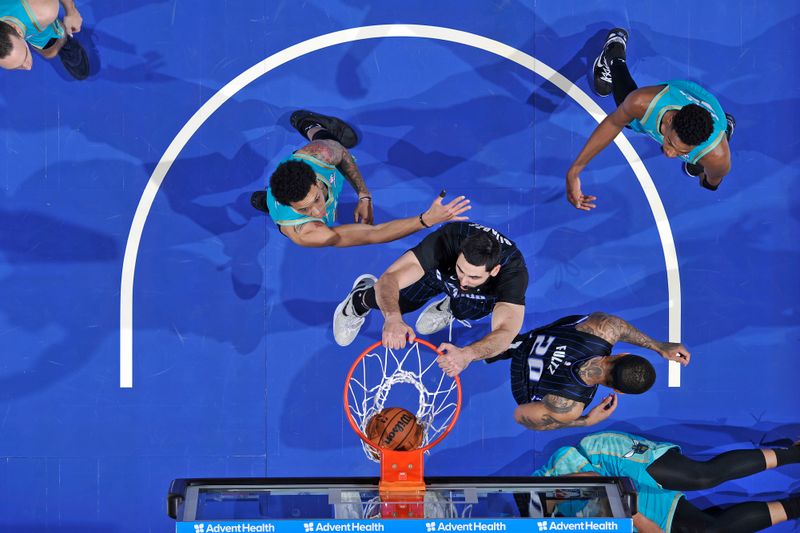 ORLANDO, FL - MARCH 19: Goga Bitadze #35 of the Orlando Magic dunks the ball during the game against the Charlotte Hornets on March 19, 2024 at the Kia Center in Orlando, Florida. NOTE TO USER: User expressly acknowledges and agrees that, by downloading and or using this photograph, User is consenting to the terms and conditions of the Getty Images License Agreement. Mandatory Copyright Notice: Copyright 2024 NBAE (Photo by Fernando Medina/NBAE via Getty Images)